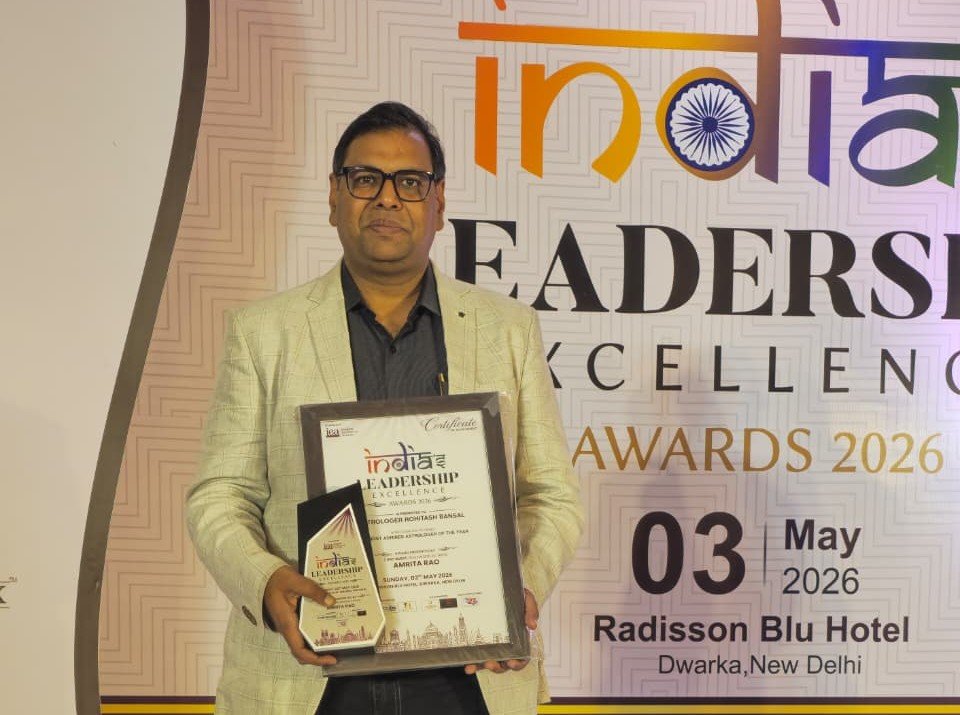 Astrologer Rohitash Bansal holding Most Admired Astrologer of the Year 2026 award and certificate